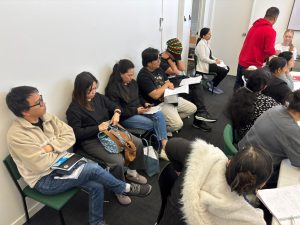 International nurses attending IQN and OSCE briefing session in New Zealand classroom setting
